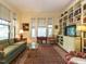 Cozy living room with natural light, classic furnishings, and built-in bookshelves for added charm at 1811 Park Dr, Raleigh, NC 27605