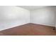 Bedroom featuring wood laminate flooring, white walls, and plenty of natural light at 1813 Grady Dr, Durham, NC 27712
