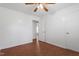 Spacious bedroom featuring wood floors, a ceiling fan, and ample natural light at 1813 Grady Dr, Durham, NC 27712