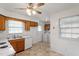 Kitchen featuring wood cabinets, white countertops, and a view of the laundry area at 1813 Grady Dr, Durham, NC 27712