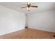 A spacious living room featuring laminate flooring and a ceiling fan for added comfort at 1813 Grady Dr, Durham, NC 27712