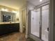 Well-appointed ensuite bathroom featuring a double vanity and modern walk-in shower at 198 Shadowbark Dr, Garner, NC 27529