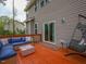 Red-stained wood deck with furniture and access to the home's interior at 198 Shadowbark Dr, Garner, NC 27529