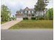 Charming two-story home with an attached two-car garage and landscaped front yard at 198 Shadowbark Dr, Garner, NC 27529