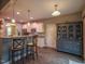 A view of the kitchen with breakfast bar, granite counters, and a wet bar, perfect for entertaining at 198 Shadowbark Dr, Garner, NC 27529