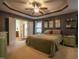The spacious main bedroom offers a tray ceiling, ensuite bathroom and walk in closet at 198 Shadowbark Dr, Garner, NC 27529
