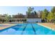 Relaxing community pool area with covered seating, perfect for enjoying sunny days with Gathering and friends at 198 Shadowbark Dr, Garner, NC 27529