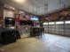 Finished garage space with arcade games, TVs, and plenty of room for entertaining at 198 Shadowbark Dr, Garner, NC 27529