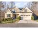 Charming single Gathering home with a two-car garage and well-maintained landscaping at 2000 Monthaven Dr, Wake Forest, NC 27587