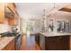 Stylish kitchen featuring granite countertops, stainless steel appliances, and hardwood floors at 2000 Monthaven Dr, Wake Forest, NC 27587