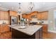 Modern kitchen with granite countertops, stainless steel appliances, island, and hardwood flooring at 2000 Monthaven Dr, Wake Forest, NC 27587
