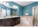 Bright bathroom features double vanity, soaking tub, and glass-enclosed shower at 214 S Camellia St, Chapel Hill, NC 27516