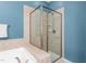 Modern bathroom with a glass-enclosed shower and tiled walls at 214 S Camellia St, Chapel Hill, NC 27516