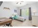Comfortable bedroom with a window view, alongside a wooden desk and a white dresser at 214 S Camellia St, Chapel Hill, NC 27516