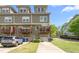 Charming townhome showcases a private balcony, garage, and well-maintained landscaping for curb appeal at 214 S Camellia St, Chapel Hill, NC 27516