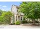 Charming two-story townhome featuring a well-maintained lawn and a welcoming front porch at 214 S Camellia St, Chapel Hill, NC 27516