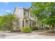 Charming two-story townhome featuring a well-maintained lawn and a welcoming front porch at 214 S Camellia St, Chapel Hill, NC 27516