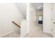 Well-lit hallway features neutral carpet and leads to a bedroom in this bright, inviting home at 214 S Camellia St, Chapel Hill, NC 27516