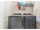 Well-organized laundry area features modern Samsung washer and dryer with shelving and storage options at 214 S Camellia St, Chapel Hill, NC 27516