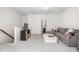 Bright living area boasts a comfortable couch and convenient access to an adjacent bathroom at 214 S Camellia St, Chapel Hill, NC 27516