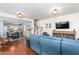 Open concept living room with hardwood floors, modern lighting, and ample seating at 214 S Camellia St, Chapel Hill, NC 27516