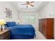 Bright and airy main bedroom with a tray ceiling and large windows at 214 S Camellia St, Chapel Hill, NC 27516
