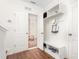 Functional mudroom with built-in bench, shelving, and hooks for organized entry and storage solutions at 214 S Camellia St, Chapel Hill, NC 27516