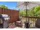 Comfortable outdoor patio with an umbrella, grill, table and chairs at 214 S Camellia St, Chapel Hill, NC 27516