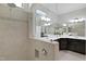 Modern bathroom with a glass-enclosed walk-in shower, double vanity, and a large mirror at 216 Bella Rose Dr, Chapel Hill, NC 27517