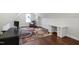 Bright bedroom with hardwood floors, a cozy armchair, and a desk for work or hobbies at 216 Bella Rose Dr, Chapel Hill, NC 27517
