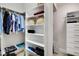 Organized walk-in closet with shelving and hanging space for clothing and accessories at 216 Bella Rose Dr, Chapel Hill, NC 27517