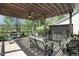 Shaded back deck featuring cushioned chairs and a rock water feature, perfect for relaxation at 216 Bella Rose Dr, Chapel Hill, NC 27517