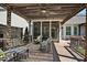 Relaxing back deck, with dark stained pergola, and comfortable cushioned chairs at 216 Bella Rose Dr, Chapel Hill, NC 27517