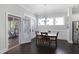 Bright dining area with hardwood floors and easy access to porch at 216 Bella Rose Dr, Chapel Hill, NC 27517