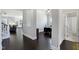 Open hallway with hardwood floors, leading to an office and bathroom at 216 Bella Rose Dr, Chapel Hill, NC 27517