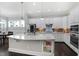 Modern kitchen with white cabinets, granite countertops, and stainless steel appliances at 216 Bella Rose Dr, Chapel Hill, NC 27517