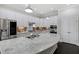 Spacious kitchen with white cabinets, stainless appliances, and granite countertops at 216 Bella Rose Dr, Chapel Hill, NC 27517
