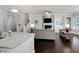 Open-concept living room with staircase, fireplace, and dark hardwood floors at 216 Bella Rose Dr, Chapel Hill, NC 27517