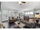 Spacious living room with large windows and comfortable sofas at 216 Bella Rose Dr, Chapel Hill, NC 27517