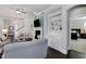 Comfortable living room with fireplace and built-in shelves, with view to bedroom at 216 Bella Rose Dr, Chapel Hill, NC 27517