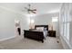 Serene bedroom with bedside tables, lamps and ensuite bathroom at 216 Bella Rose Dr, Chapel Hill, NC 27517