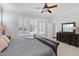 Bright bedroom with dresser, closet and large windows at 216 Bella Rose Dr, Chapel Hill, NC 27517