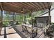 Relaxing outdoor deck with a pergola, ceiling fan, and cozy seating area at 216 Bella Rose Dr, Chapel Hill, NC 27517