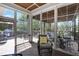 Relaxing screened-in patio with comfortable seating, perfect for enjoying the outdoors at 216 Bella Rose Dr, Chapel Hill, NC 27517