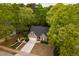 Aerial view of home featuring a long driveway, mature trees and a well-manicured lawn at 216 Harvester Dr, Holly Springs, NC 27540