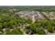 An aerial view of a neighborhood with mature trees and well-maintained homes at 216 Harvester Dr, Holly Springs, NC 27540