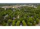 Scenic aerial view of a residential area with lush green trees and winding roads at 216 Harvester Dr, Holly Springs, NC 27540