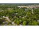 An aerial view of a neighborhood with mature trees and well-maintained homes at 216 Harvester Dr, Holly Springs, NC 27540
