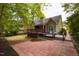Backyard view with a patio and deck, ideal for relaxation and gatherings at 216 Harvester Dr, Holly Springs, NC 27540