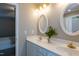 Bright bathroom with double vanity, white countertops, and gold accents at 216 Harvester Dr, Holly Springs, NC 27540